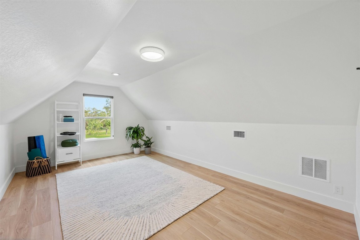 333 Stallion Lane Dripping Springs, TX 78620 - Photo 24 of 40 wooden floor in an empty room with a window