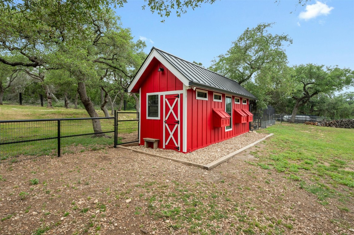 333 Stallion Lane Dripping Springs, TX 78620 - Photo 32 of 40 a view of backyard with wooden fence