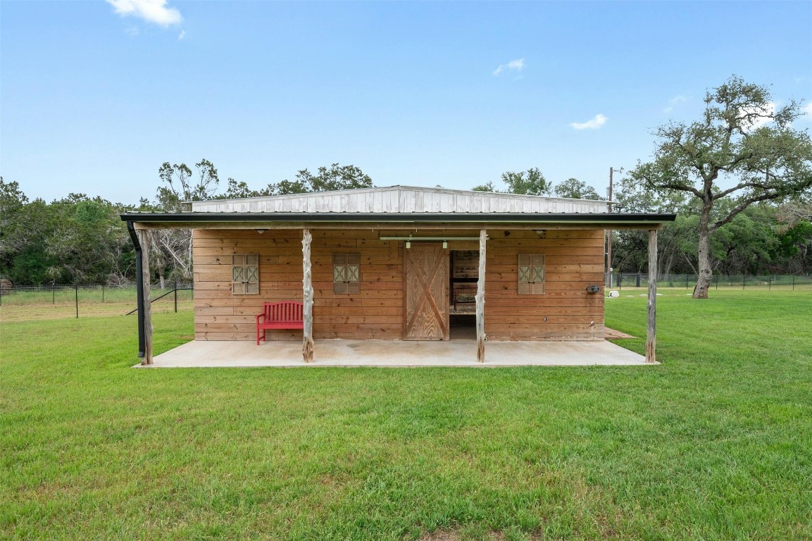 333 Stallion Lane Dripping Springs, TX 78620 - Photo 33 of 40 a view of a house with a yard and sitting area