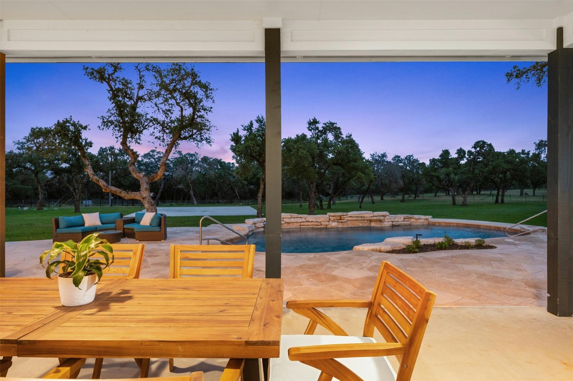 333 Stallion Lane Dripping Springs, TX 78620 - Photo 35 of 40 a view of a swimming pool with a patio
