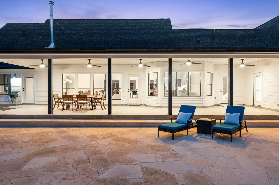 333 Stallion Lane Dripping Springs, TX 78620 - Photo 36 of 40 a living room with furniture and a floor to ceiling window