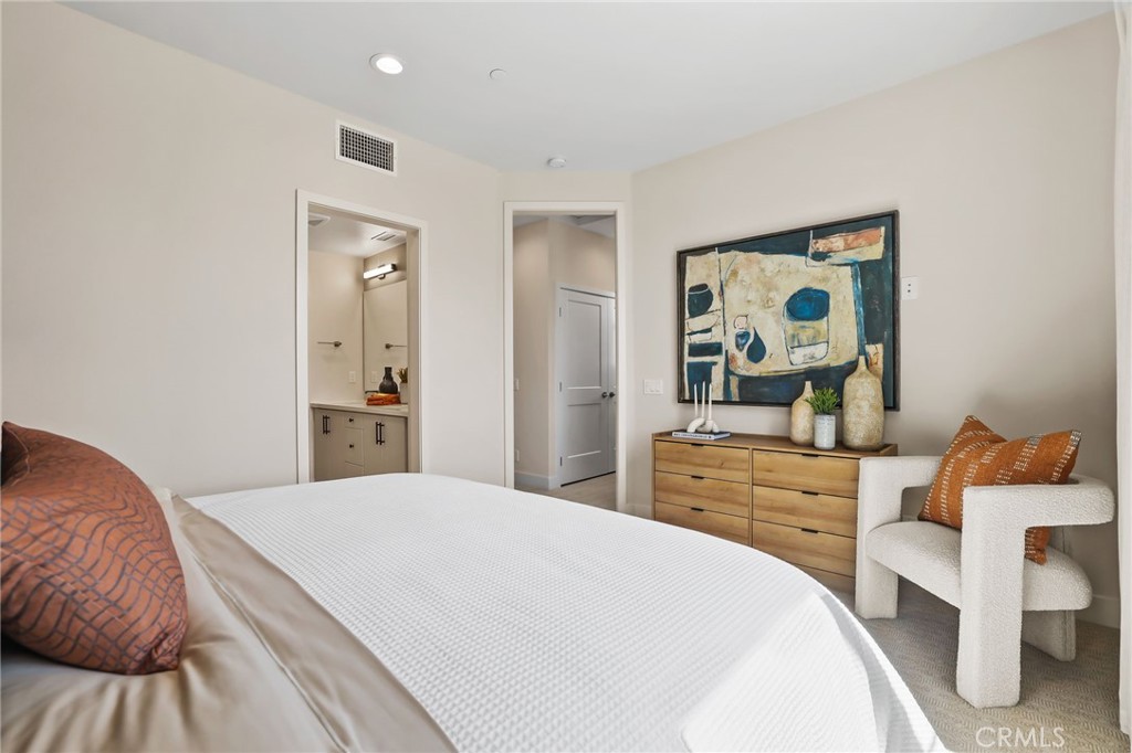 19071 Main Street, Unit 105 Huntington Beach, CA 92648 - Photo 11 of 18 a bedroom with a bed and a dresser