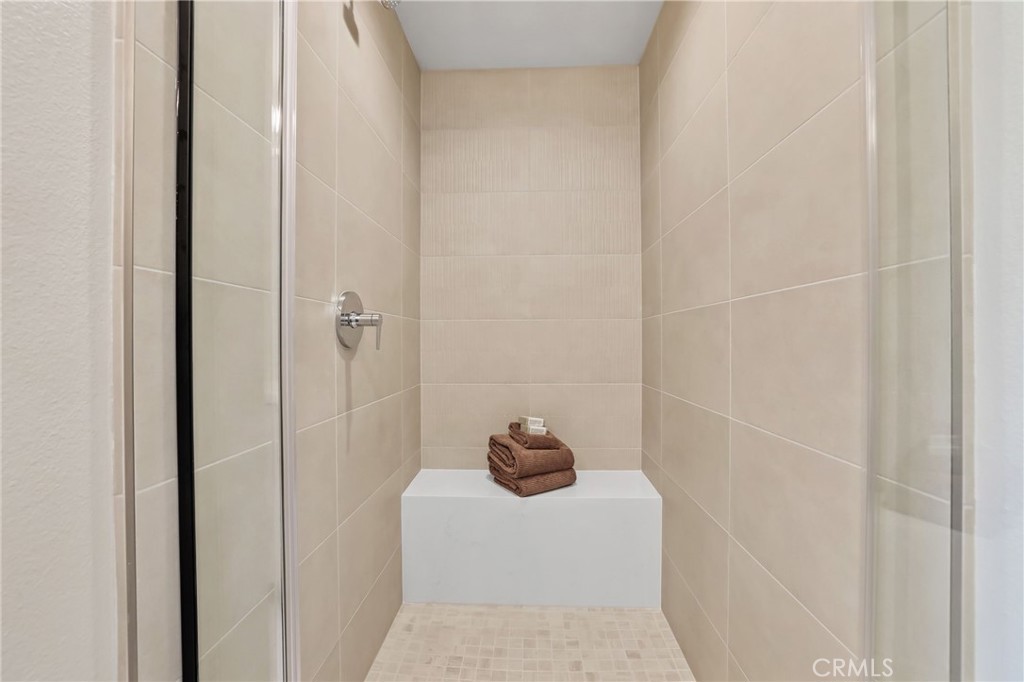 19071 Main Street, Unit 105 Huntington Beach, CA 92648 - Photo 14 of 18 a bathroom with a shower