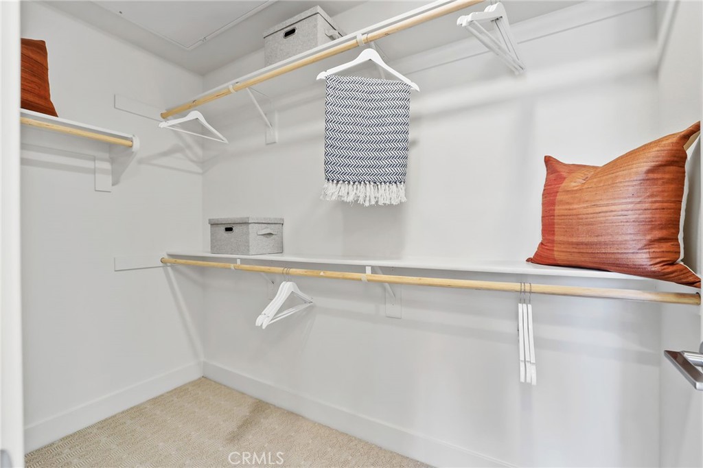 19071 Main Street, Unit 105 Huntington Beach, CA 92648 - Photo 15 of 18 a view of storage and utility room with racks on the wall