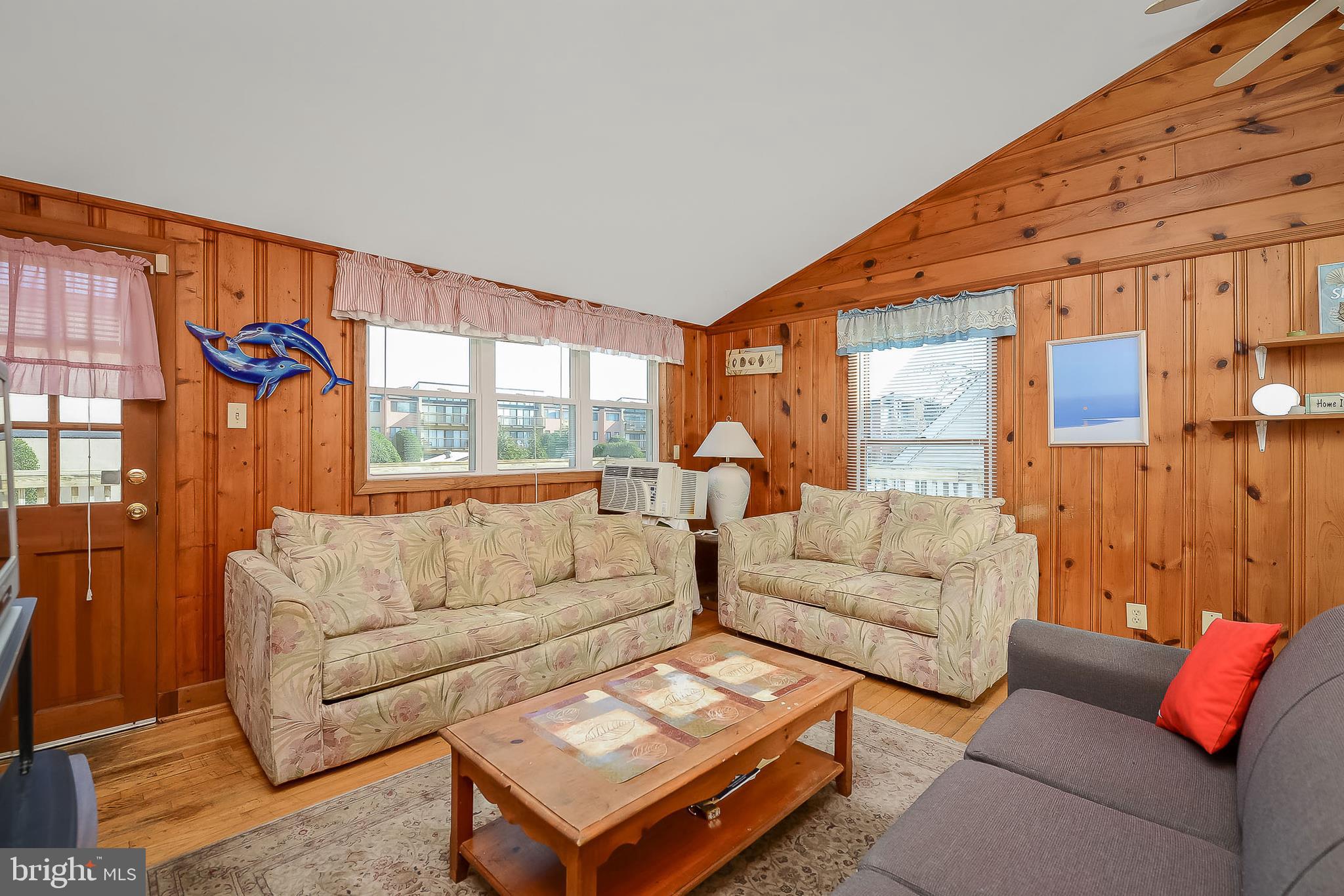 14013 North Ocean Road Ocean City, MD 21842 - Photo 13 of 35 LIVING ROOM: knotty pine walls