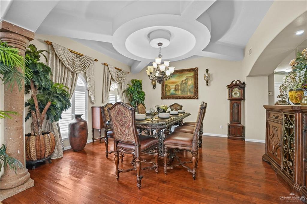 2809 Santa Laura Street Mission, TX 78572 - Photo 12 of 41 a view of a dining room with furniture and wooden floor