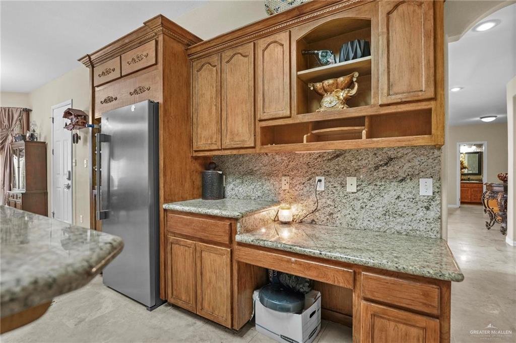 2809 Santa Laura Street Mission, TX 78572 - Photo 20 of 41 a kitchen with stainless steel appliances granite countertop a sink and a refrigerator