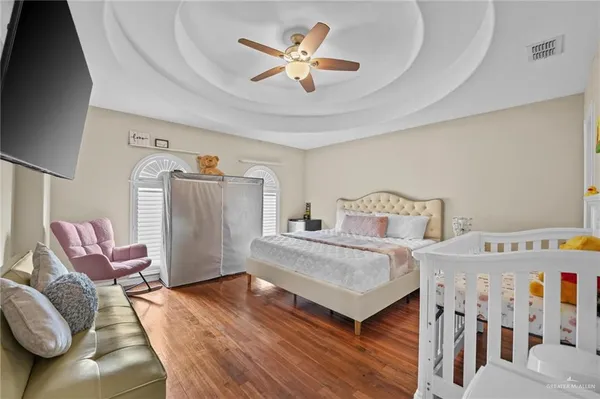 a bedroom with furniture and a chandelier