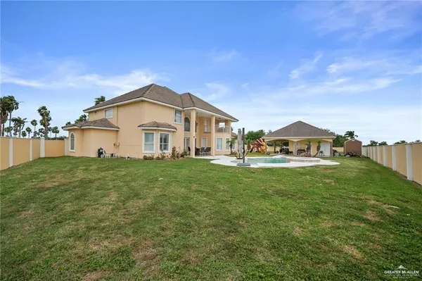 a view of a house with a big yard