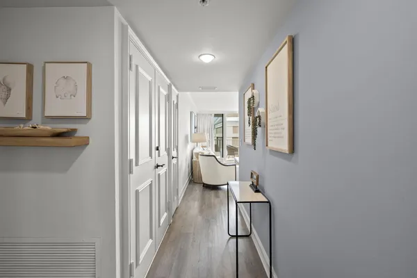 a kitchen with a white cabinets and white refrigerator