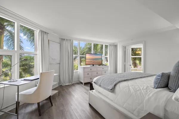 a room with a bed and a cabinets
