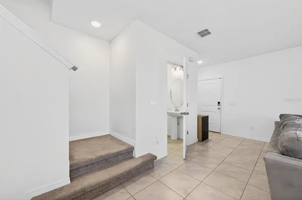 a bed room with a bed and a large window