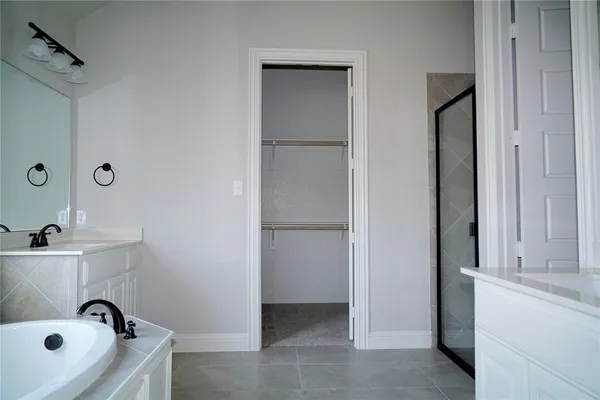 a bathroom with a tub and sink