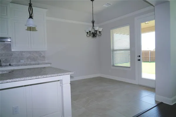 a view of a kitchen sink and a window