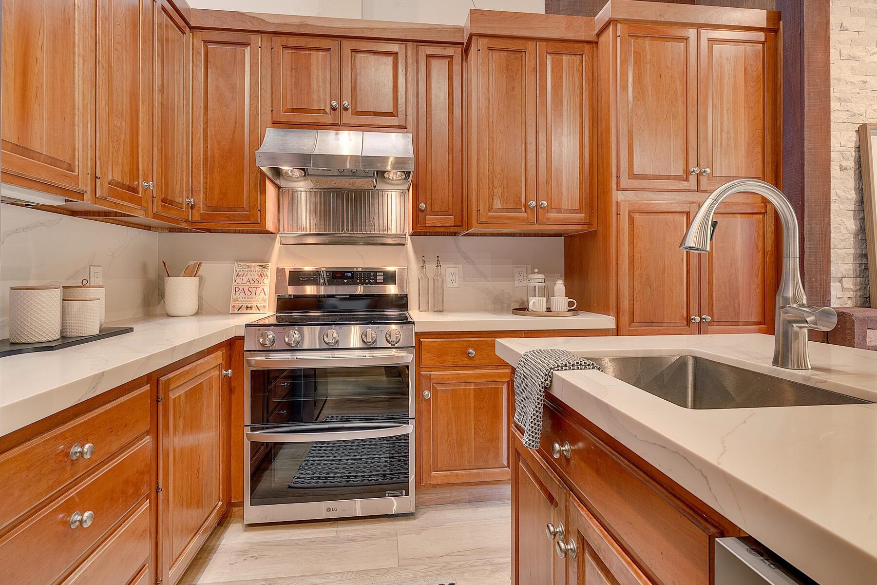 205 Alpine Meadows Road, Unit 2 Alpine Meadows, CA 96145 - Photo 11 of 28 a kitchen with granite countertop a sink stainless steel appliances and cabinets