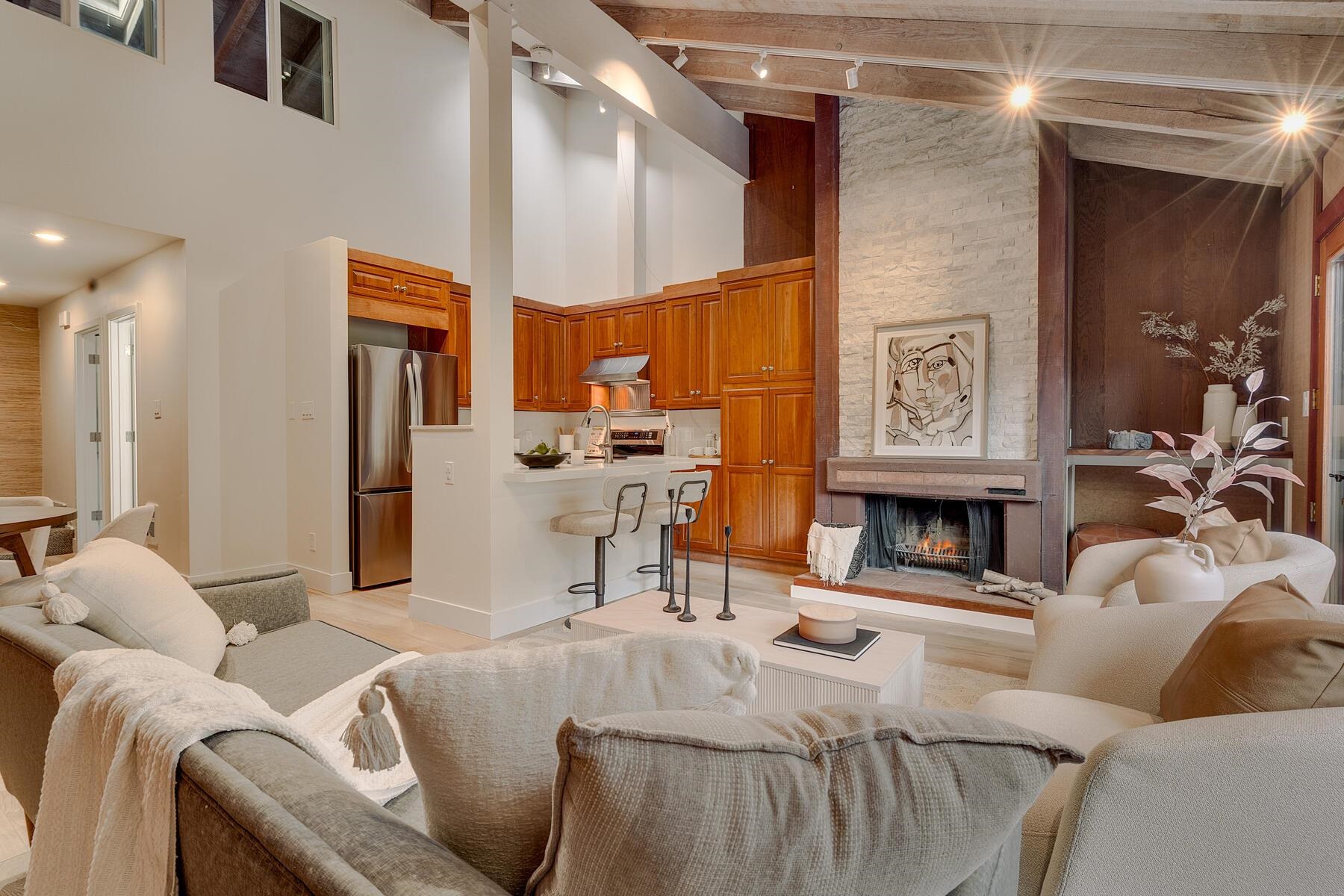 205 Alpine Meadows Road, Unit 2 Alpine Meadows, CA 96145 - Photo 5 of 28 a living room with furniture and a fireplace