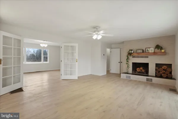a view of an empty room with a bathroom
