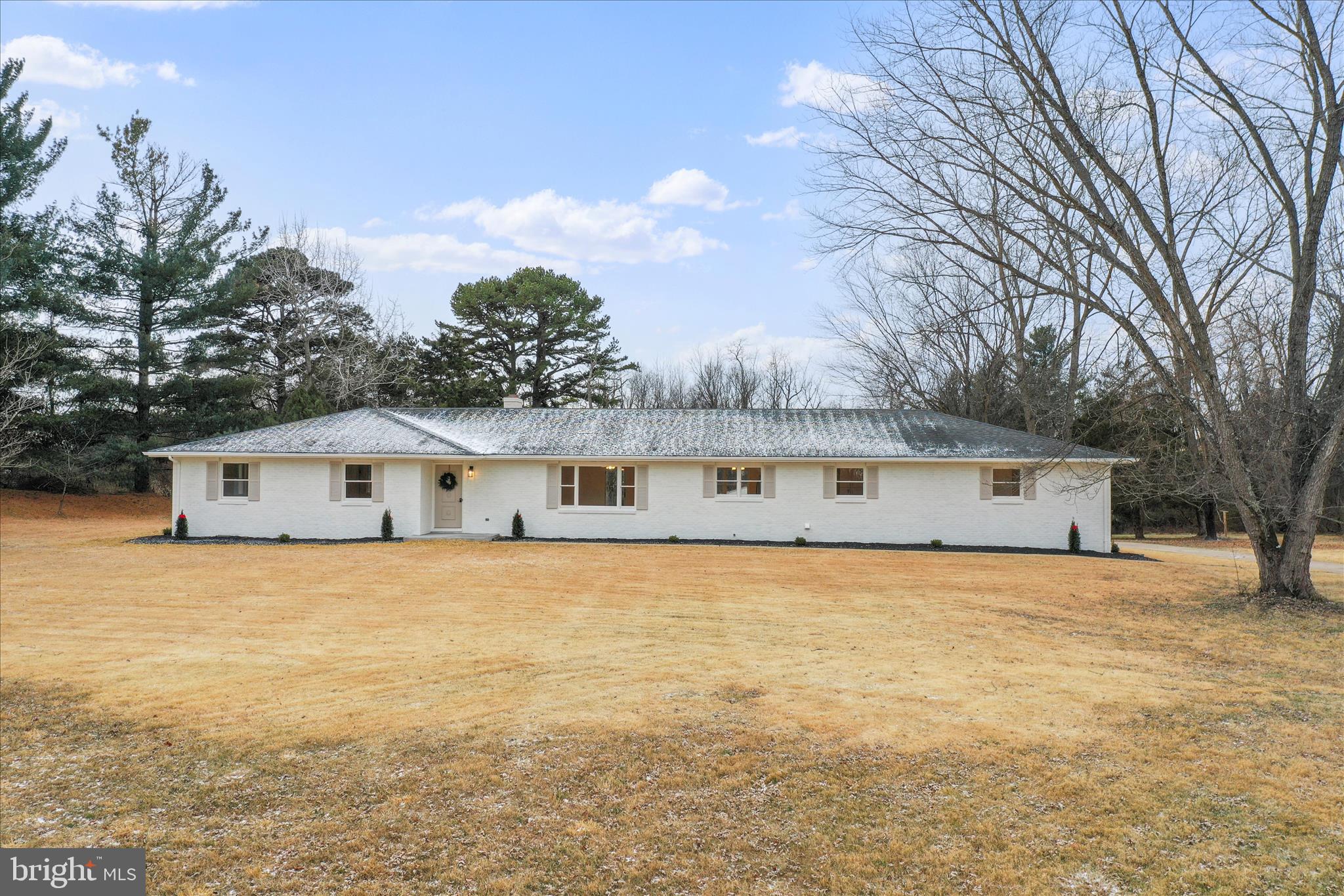 717 West Locust Street Woodstock, VA 22664 - Photo 2 of 71 a front view of a house with a yard and garage