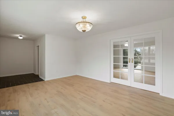 an empty room with a ceiling fan