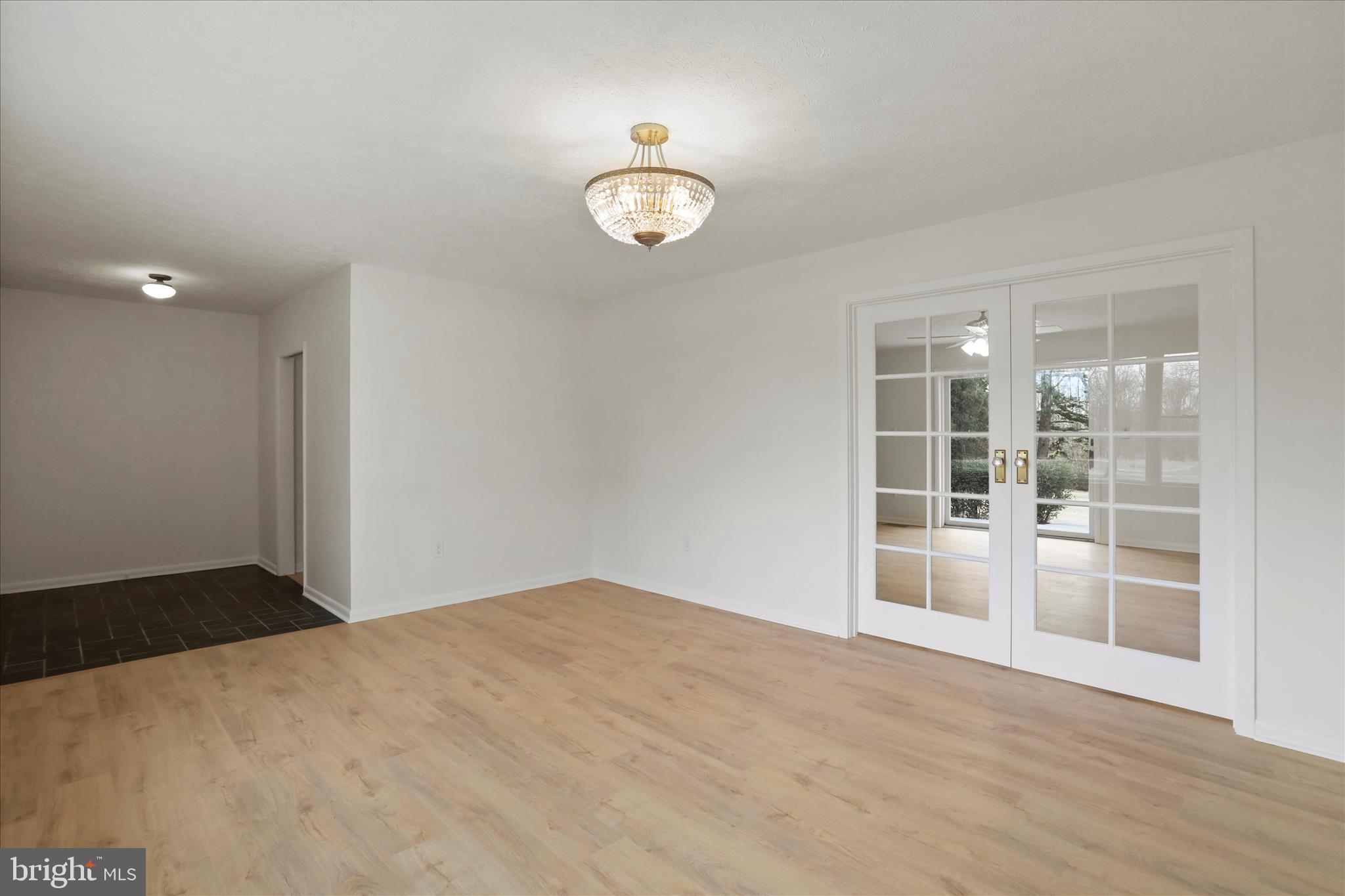 717 West Locust Street Woodstock, VA 22664 - Photo 23 of 71 a view of empty room with wooden floor and fan