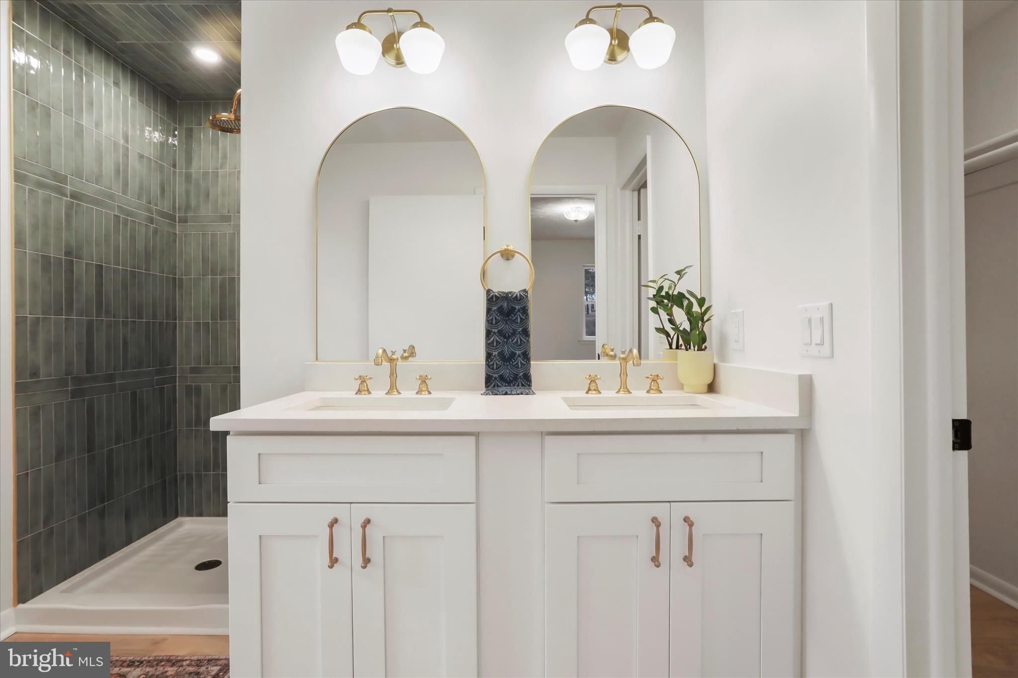 717 West Locust Street Woodstock, VA 22664 - Photo 29 of 71 a bathroom with a sink and a mirror