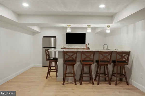 an empty room with a ceiling fan and a window