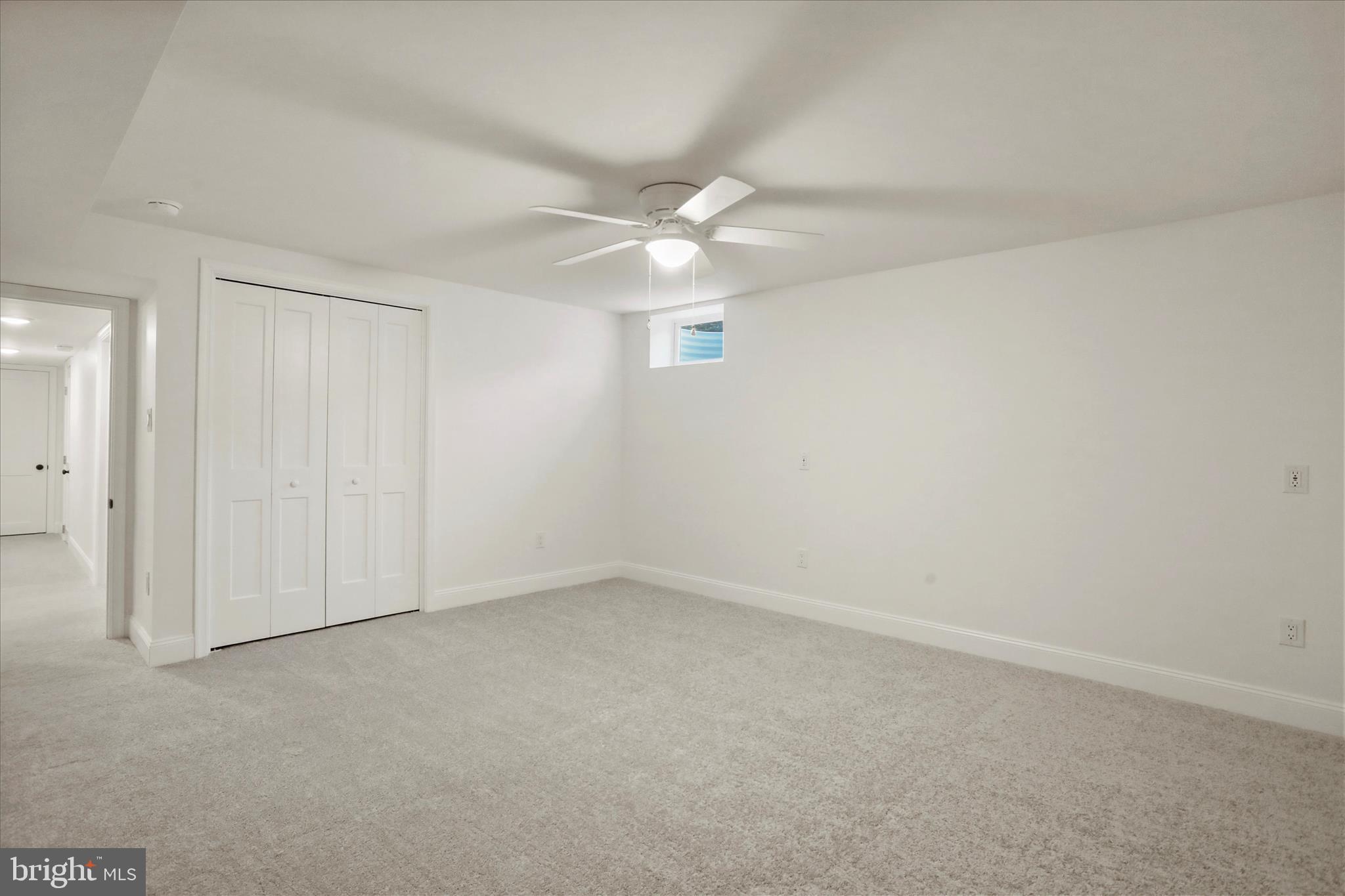 717 West Locust Street Woodstock, VA 22664 - Photo 46 of 71 an empty room with a ceiling fan and a window
