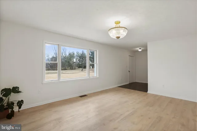 a view of an empty room with a bathroom