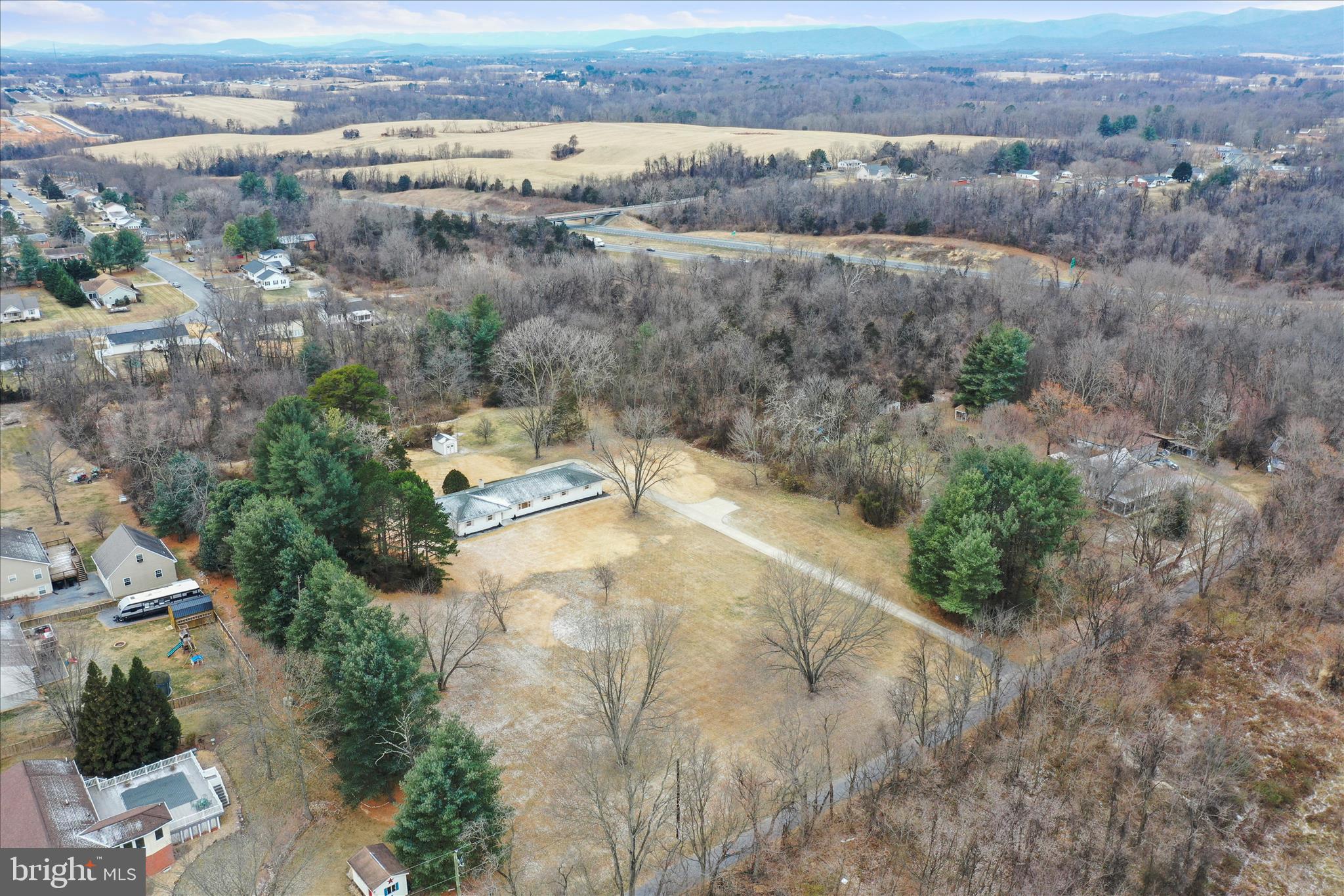 717 West Locust Street Woodstock, VA 22664 - Photo 56 of 71 an aerial view of residential houses with outdoor space and trees