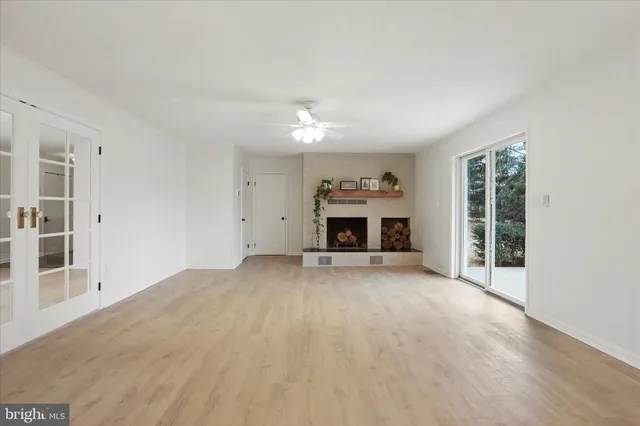 a room with a sink and a large mirror
