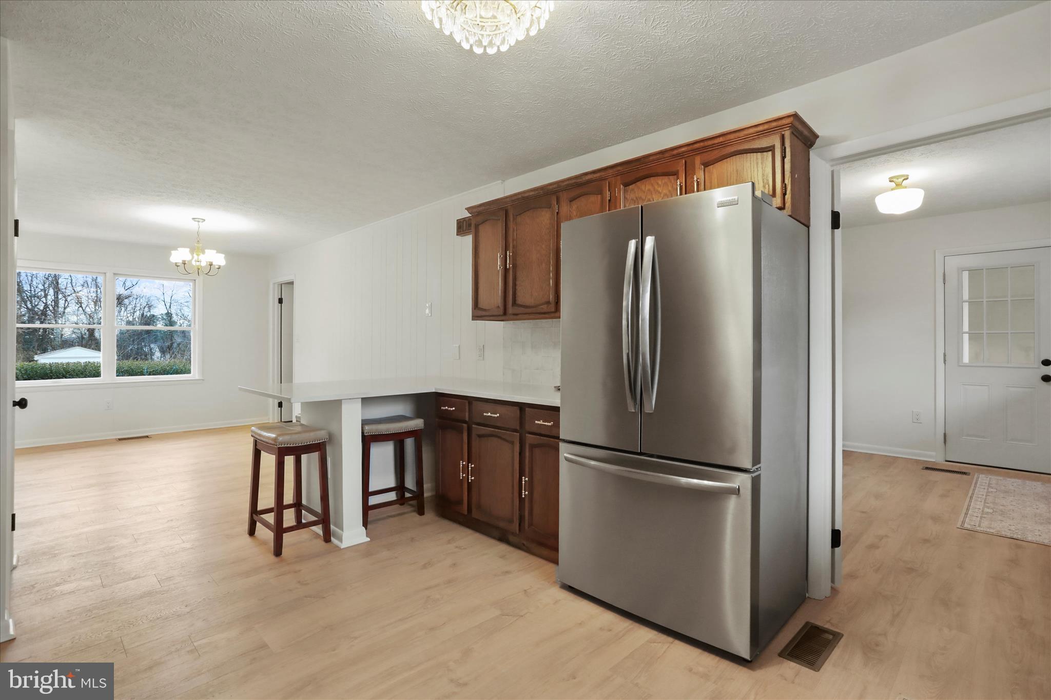 717 West Locust Street Woodstock, VA 22664 - Photo 10 of 71 a kitchen with stainless steel appliances granite countertop a refrigerator and a stove top oven
