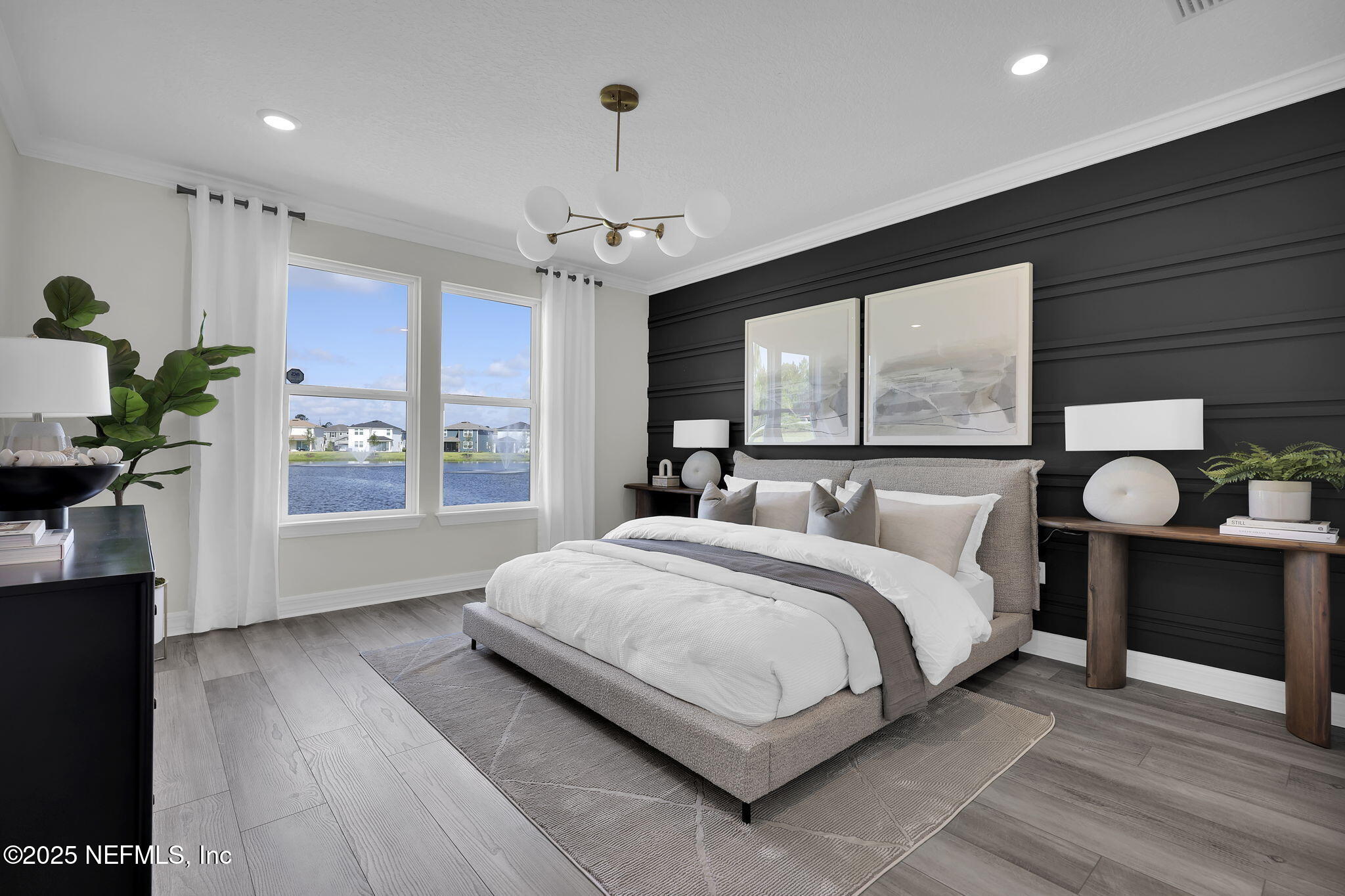 39 Blind Oak Circle St. Augustine, FL 32095 - Photo 11 of 26 a spacious bedroom with a large bed and a window