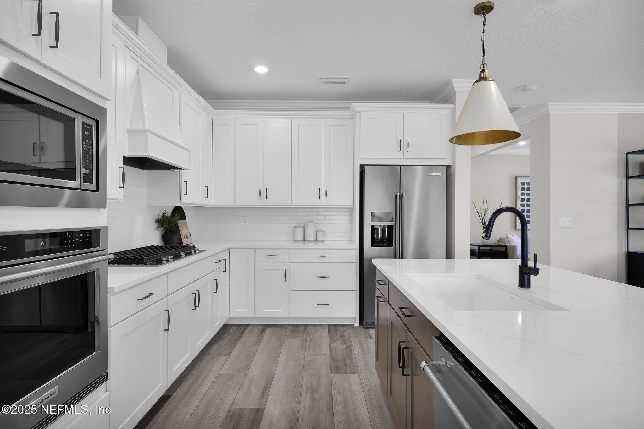 39 Blind Oak Circle St. Augustine, FL 32095 - Photo 5 of 26 a kitchen with white cabinets appliances and sink