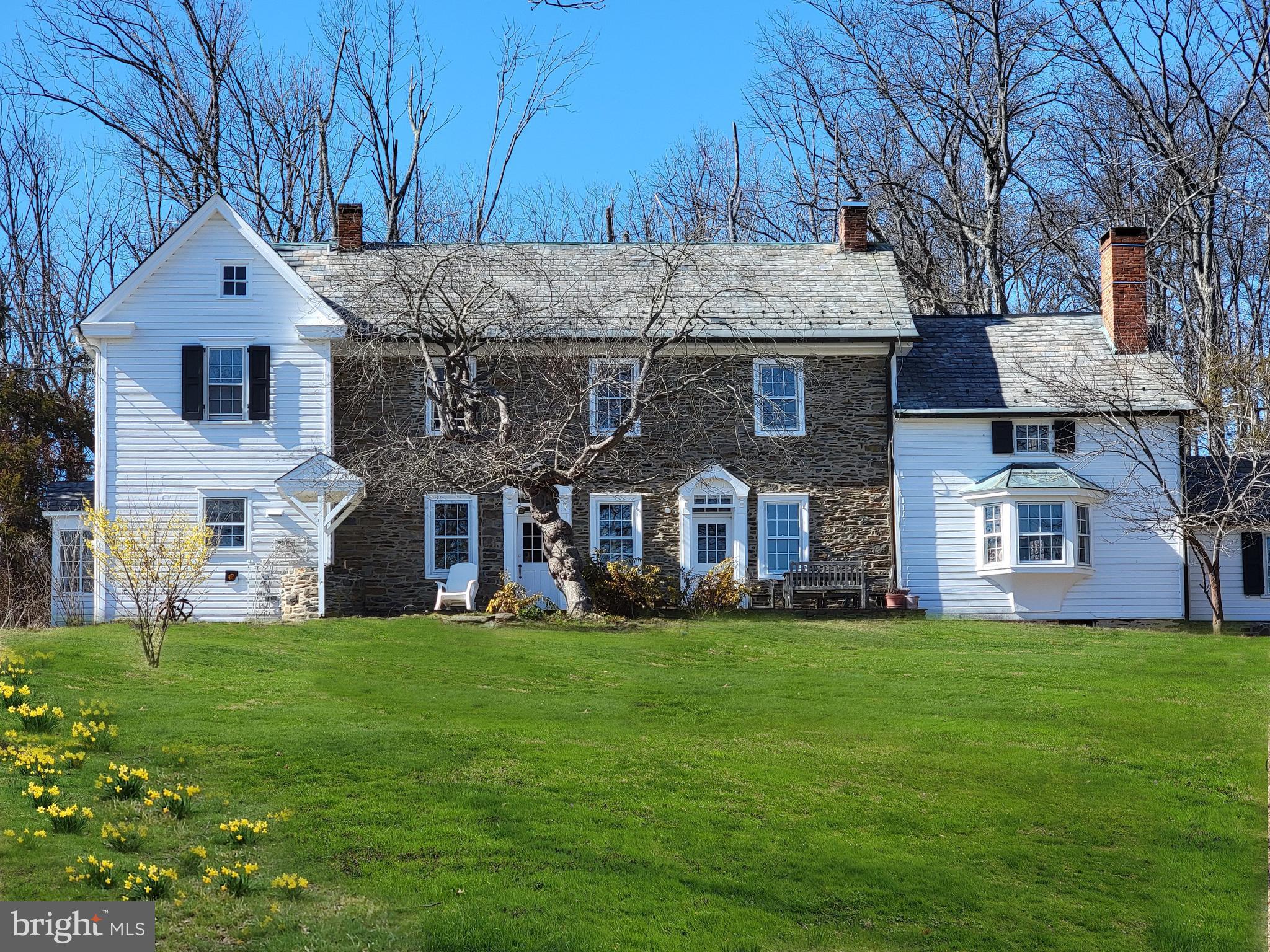 3837 Curly Hill Road Doylestown, PA 18902 - Photo 1 of 42 a front view of a house with a yard