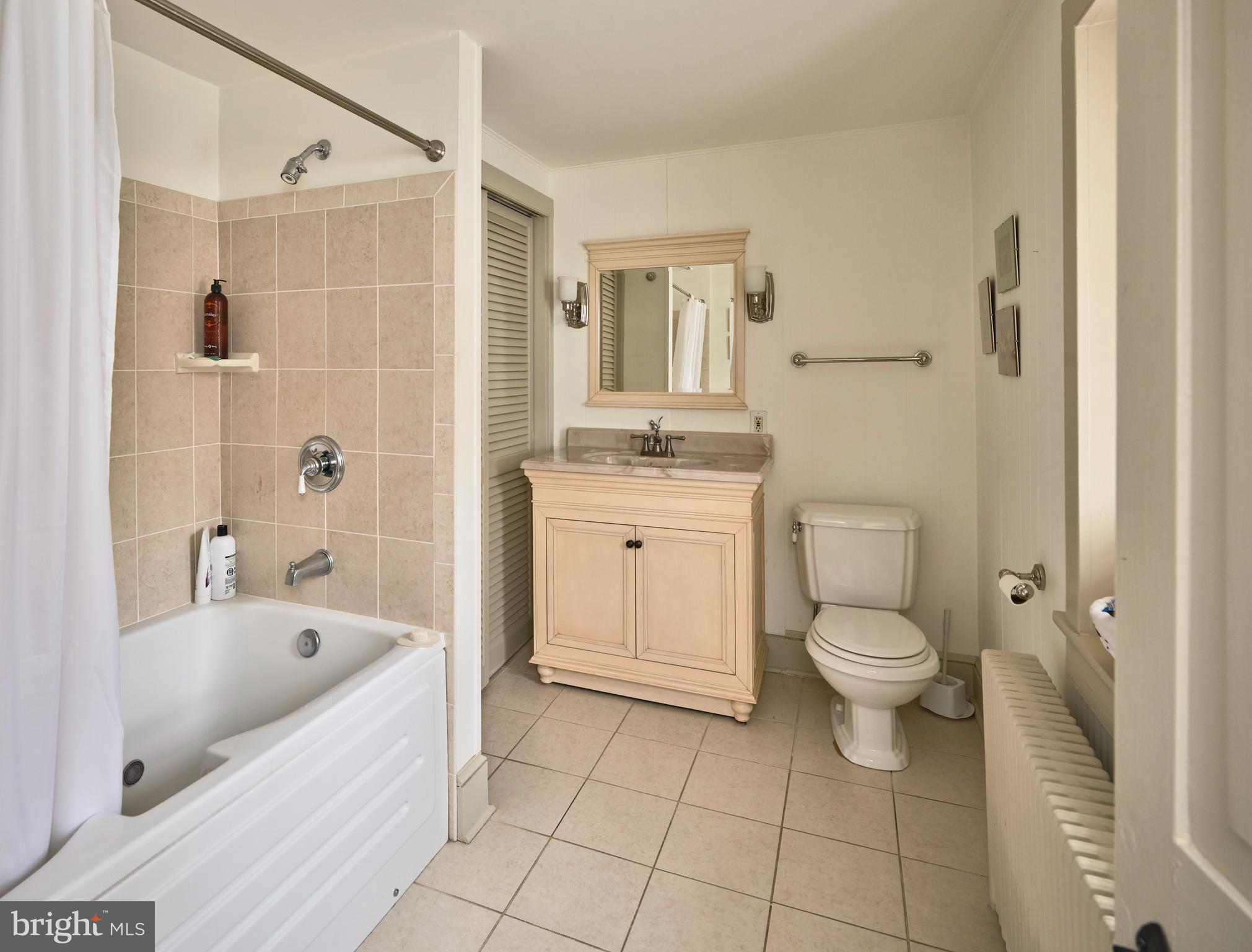 3837 Curly Hill Road Doylestown, PA 18902 - Photo 20 of 42 a bathroom with a bathtub toilet and sink