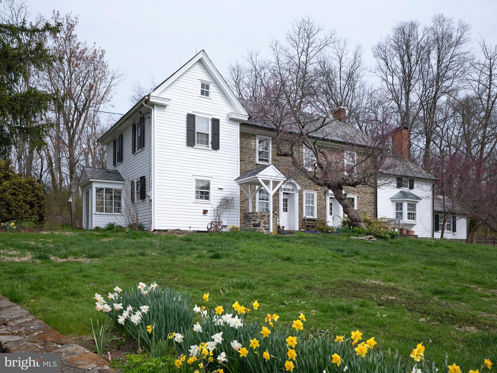 3837 Curly Hill Road Doylestown, PA 18902 - Photo 2 of 42 a front view of a house with a garden