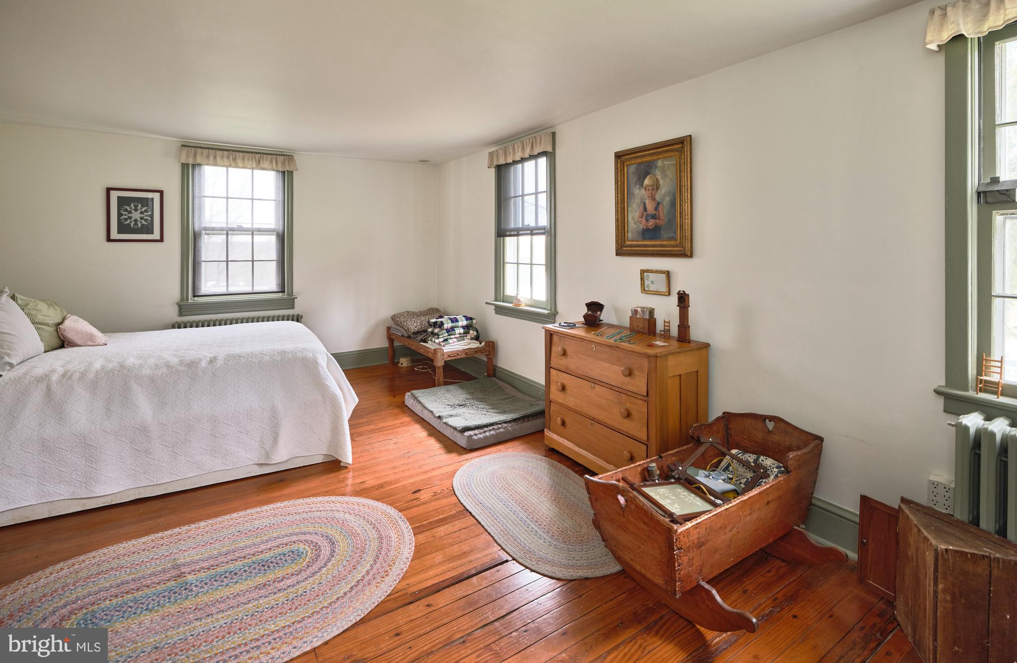 3837 Curly Hill Road Doylestown, PA 18902 - Photo 23 of 42 a bed room with a bed window and a couch