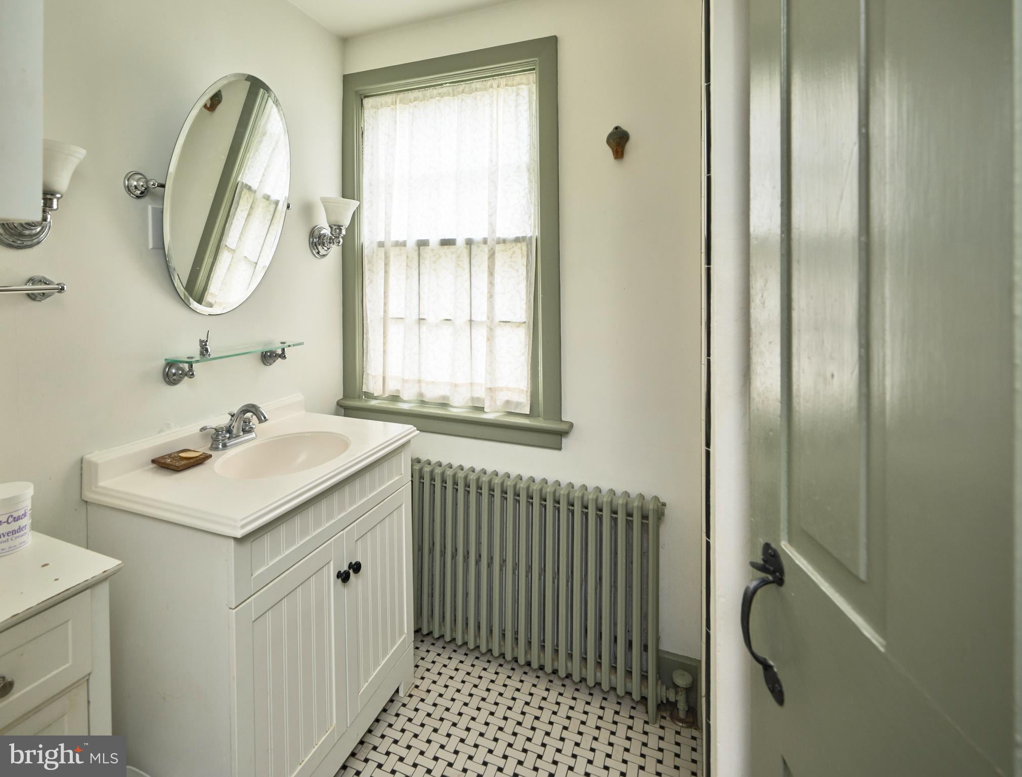 3837 Curly Hill Road Doylestown, PA 18902 - Photo 24 of 42 a bathroom with a sink a vanity and a mirror