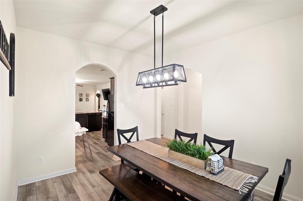 105 Patton Lane Venus, TX 76084 - Photo 12 of 29 Dining room with light wood-style flooring and arched walkways