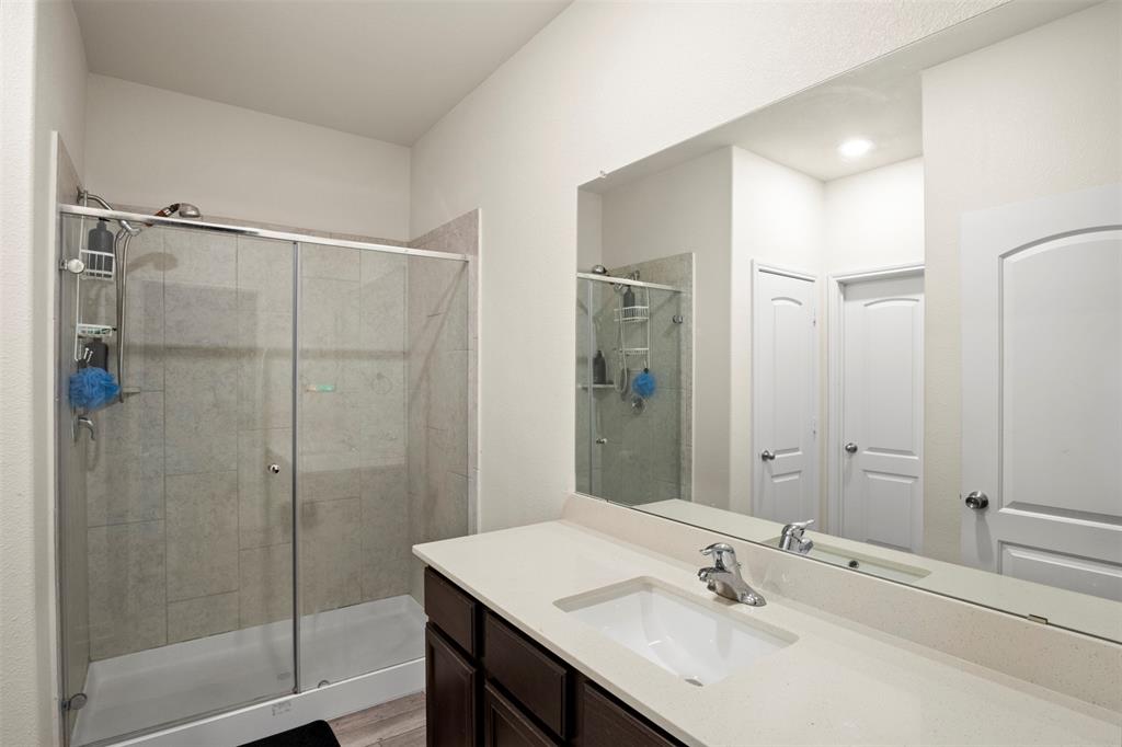 105 Patton Lane Venus, TX 76084 - Photo 17 of 29 Bathroom featuring a shower stall and vanity