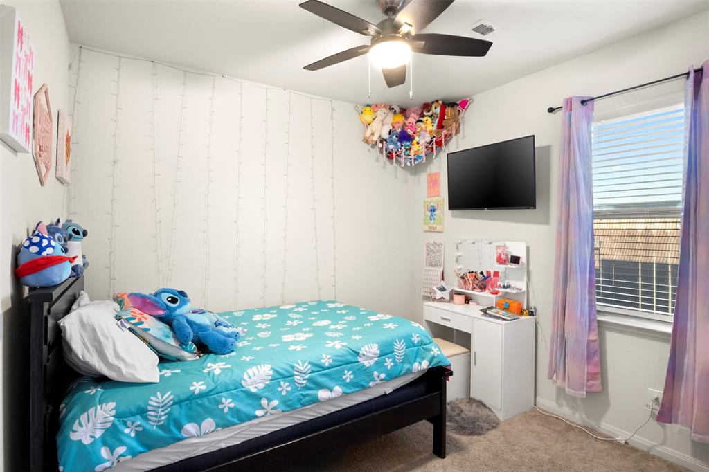 105 Patton Lane Venus, TX 76084 - Photo 19 of 29 Carpeted bedroom with ceiling fan