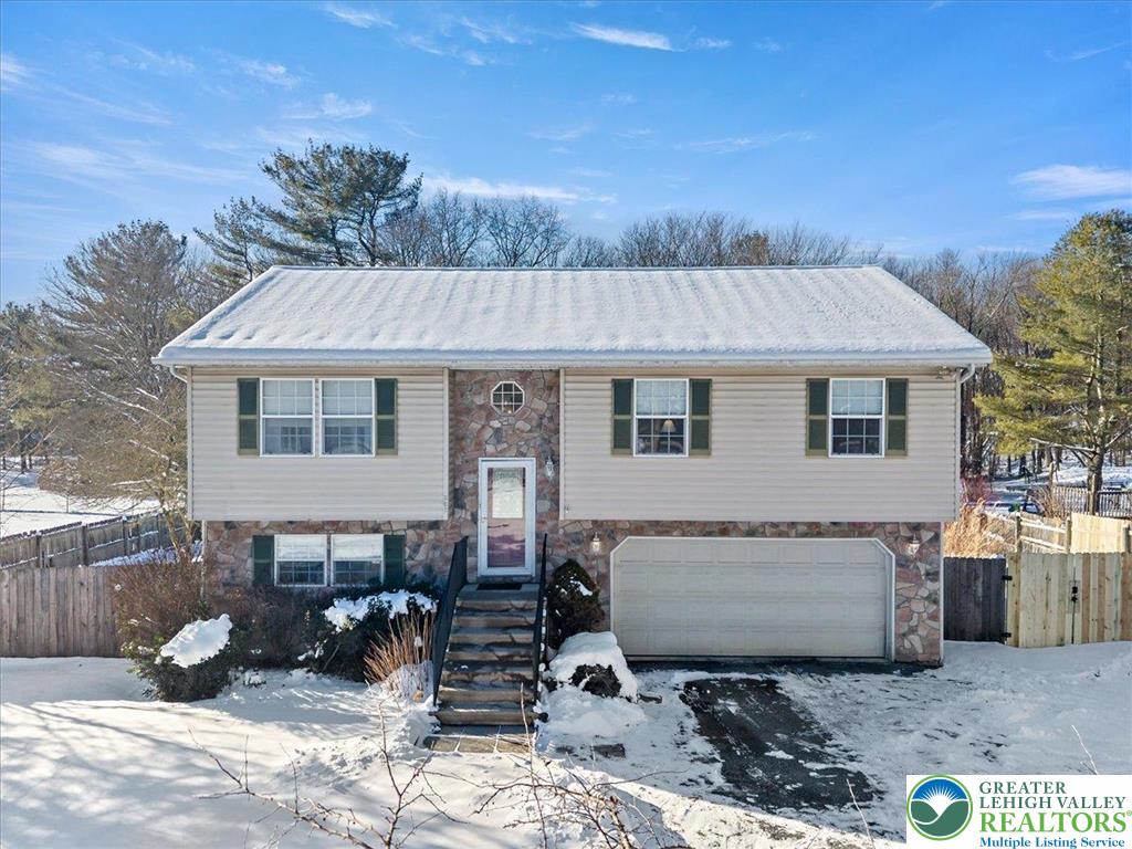 a front view of a house with sitting area