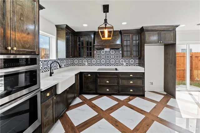 a bathroom with a sink a vanity and a large mirror