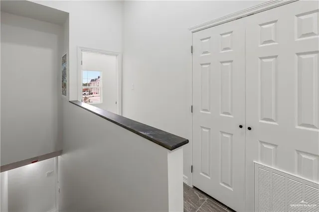 a view of staircase with white walls