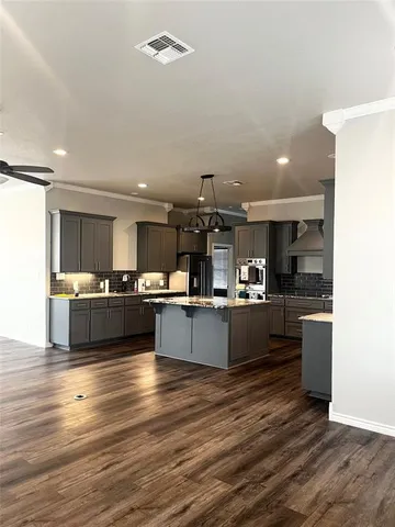 a room with a bed and a chandelier