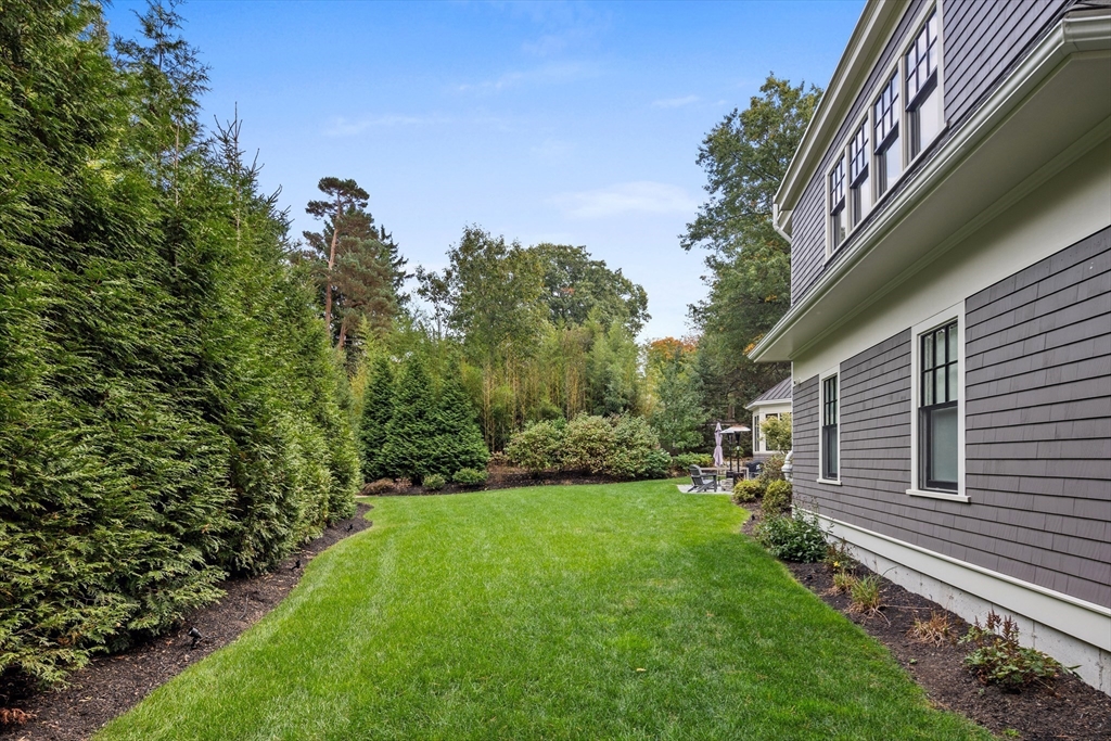 23 Crafts Road Brookline, MA 02467 - Photo 11 of 42 a view of a house with a yard