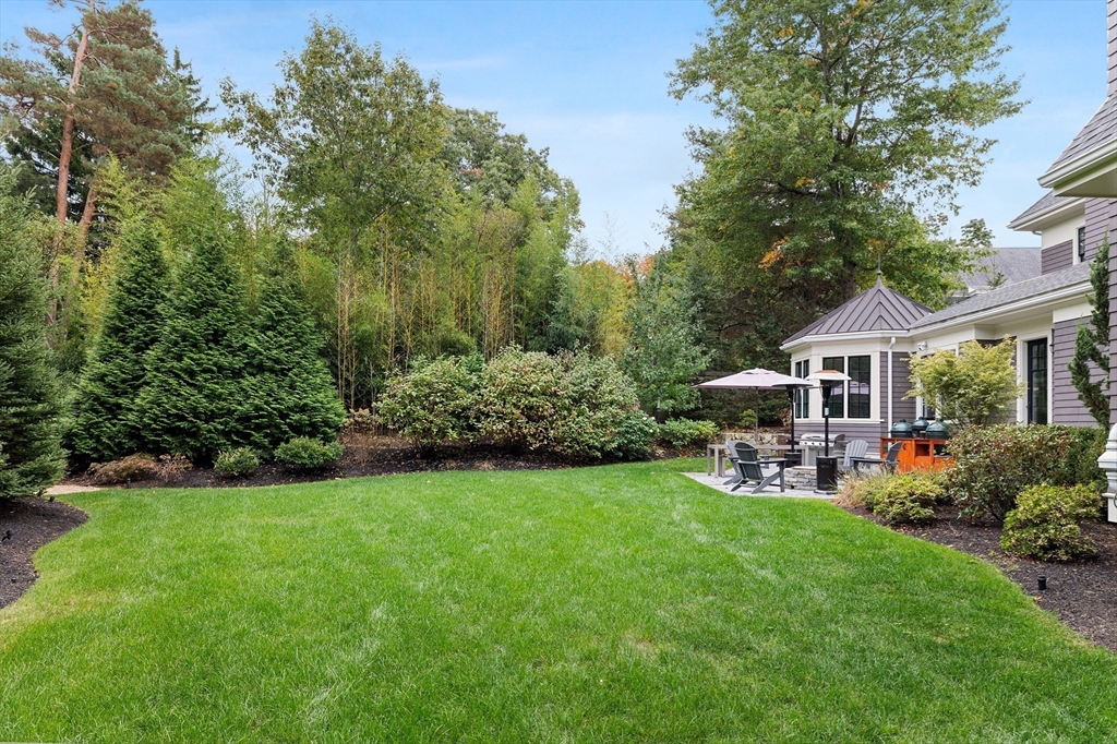 23 Crafts Road Brookline, MA 02467 - Photo 12 of 42 a view of a house with a yard and sitting area