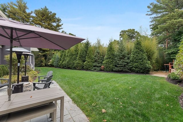 a view of a backyard with sitting area
