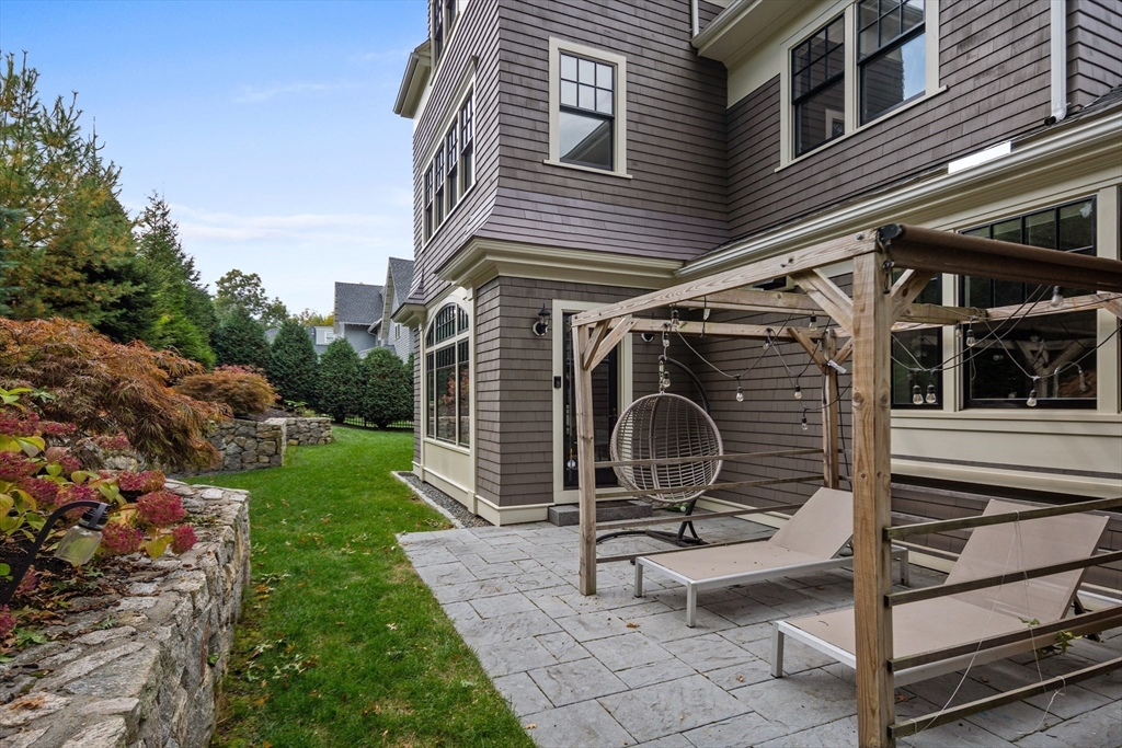23 Crafts Road Brookline, MA 02467 - Photo 16 of 42 a view of a backyard with sitting area and garden