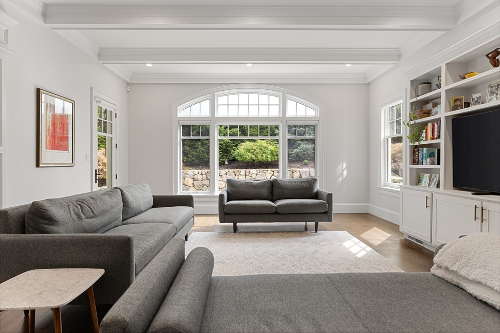 23 Crafts Road Brookline, MA 02467 - Photo 20 of 42 a living room with furniture a flat screen tv and a large window